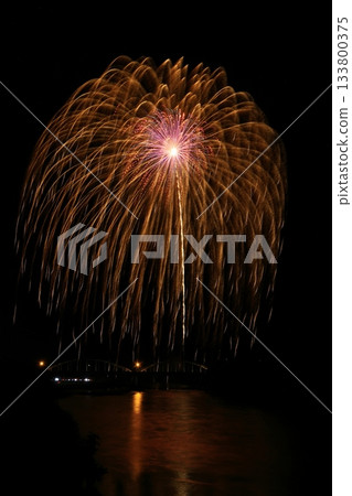 Large fireworks blooming in the summer night sky Large fireworks blooming in the summer night sky 133800375
