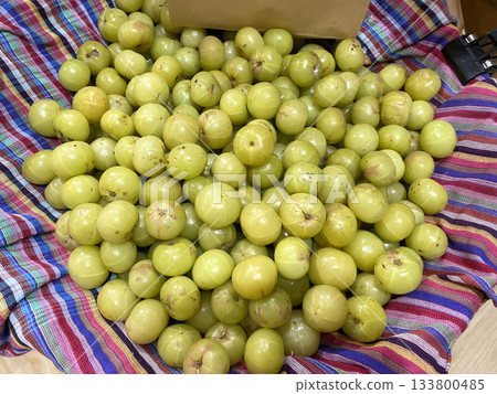 Fresh indian gooseberry pile Fresh indian gooseberry pile 133800485