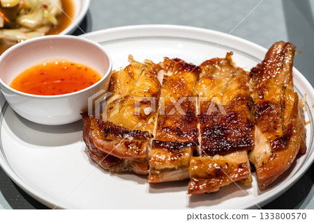 Grilled chicken with spicy sauce Grilled chicken with spicy sauce 133800570