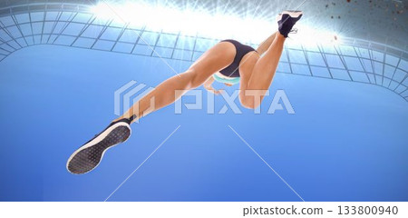 Directly below shot of female athlete long jumping Directly below shot of female athlete long jumping 133800940