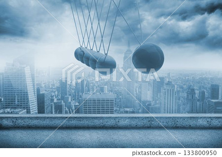 Newtons cradle above city 133800950