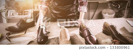 Cobbler using a tablet computer 133800961