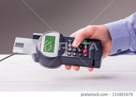 Man paying with credit card Man paying with credit card 133801079