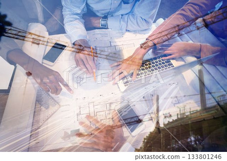 Business people discussing over blueprint in office 133801246