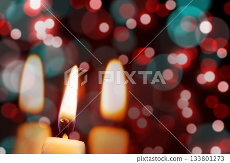 Candle burning against festive background Candle burning against festive background 133801273