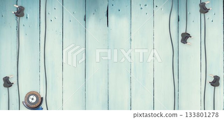 Plugs on wooden background 133801278