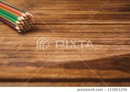 Color pencils on wooden table 133801294