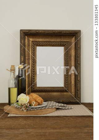 Photo frame, food and flower on table 133801345