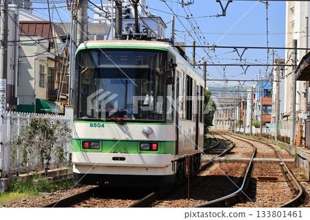 A train bound for Waseda leaving Minowabashi Station 133801461