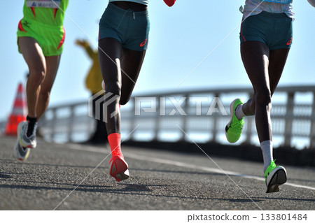 Marathon: A marathon runner running up a hill 133801484