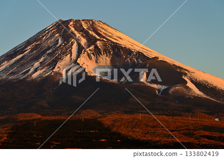 Mount Fuji and the Hoei crater at sunrise from the Torigoki Plateau Observatory on Mount Echizen in the Aitaka Mountains 133802419