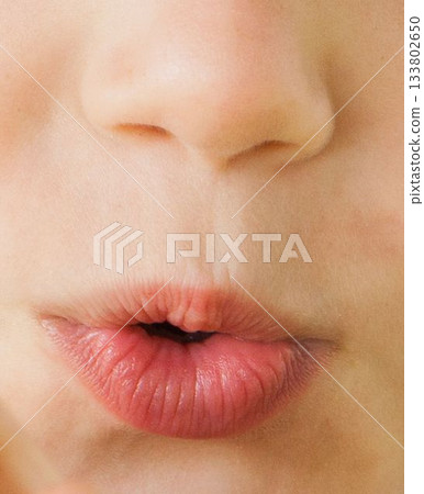 Close up of childs mouth pouting 133802650