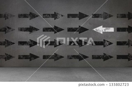 Black and white arrows on concrete wall Black and white arrows on concrete wall 133802723