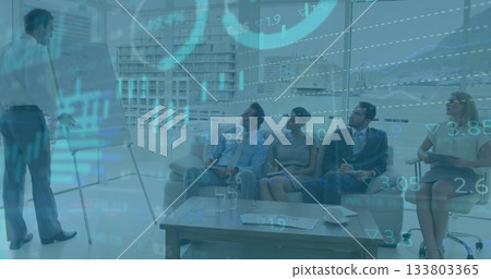 In office, diverse professionals presenting financial data with image overlaying on screen In office, diverse professionals presenting financial data with image overlaying on screen 133803365