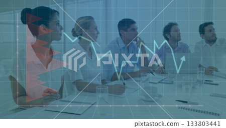 Taking notes office professionals watching line chart overlay at boardroom table, with coffee mug 133803441