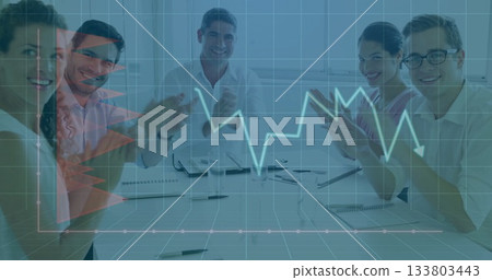 Colleagues clapping in conference room, with notebooks, laptop and documents, digital grid arrow 133803443