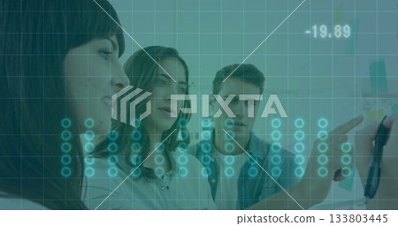 Leaning business casual colleagues reviewing diagrams on whiteboard in office with sticky notes 133803445