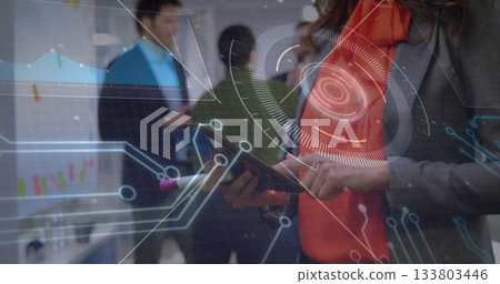 Tapping woman in grey blazer using tablet in office, with circuit HUD overlay, copy space 133803446