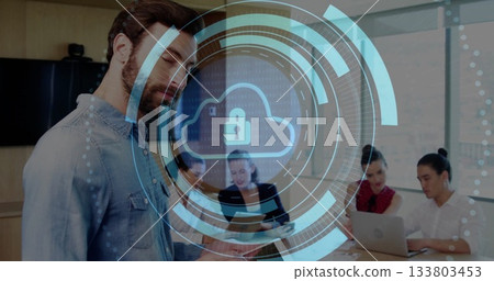 Bearded man checking smartphone in conference room, with laptop and cloud padlock overlay 133803453