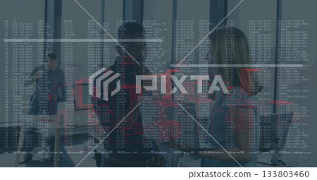 Team in business casual reviewing designs in office meeting room with laptops and code overlay 133803460