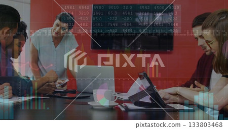 Analyzing financial data and graphs, diverse team in business meeting with image Analyzing financial data and graphs, diverse team in business meeting with image 133803468