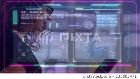 Using tablet with image overlay, person viewing data and world map 133803471