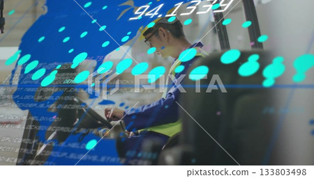 Worker in safety gear operating machinery with digital data overlay image Worker in safety gear operating machinery with digital data overlay image 133803498