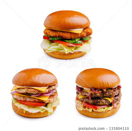 Delicious burgers with various toppings presented on a white background 133804110