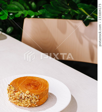 Delicious dessert served on a plate in a cozy cafe setting 133804173