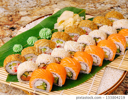 Delicious sushi platter with variety of colors and textures at dinner setting 133804219