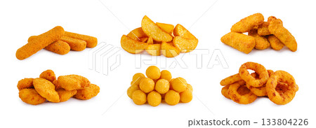 Various crispy snacks arranged on a white surface for tasty selection 133804226