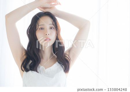 A woman basking in the morning sun 133804248