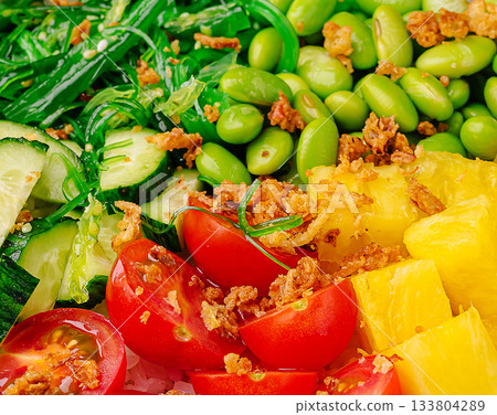 Colorful salad bowl with fresh vegetables and fruits served at lunch 133804289