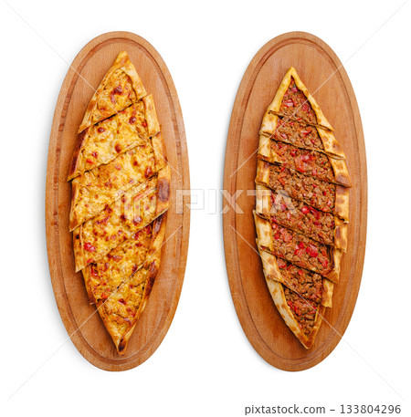Delicious Turkish pide served on wooden platters at a restaurant Delicious Turkish pide served on wooden platters at a restaurant 133804296