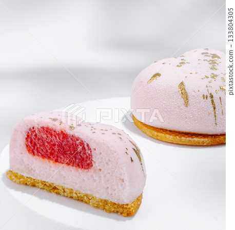 Delicious heart-shaped dessert with strawberry filling and golden accents Delicious heart-shaped dessert with strawberry filling and golden accents 133804305