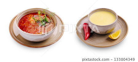 Traditional soups served in rustic bowls with fresh ingredients Traditional soups served in rustic bowls with fresh ingredients 133804349