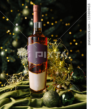 Holiday spirit displayed with a bottle of wine on a festive table 133804418