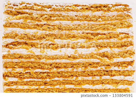 Delicious layered cake with cream filling enjoyed at a local bakery Delicious layered cake with cream filling enjoyed at a local bakery 133804591