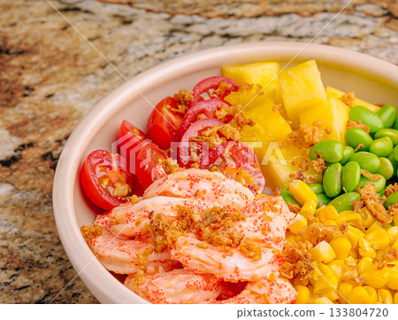 Vibrant seafood salad with shrimp, pineapple, and veggies on granite Vibrant seafood salad with shrimp, pineapple, and veggies on granite 133804720