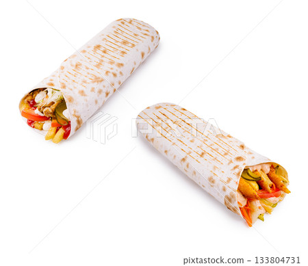 Tasty chicken and veggie wraps with fries on a white background Tasty chicken and veggie wraps with fries on a white background 133804731