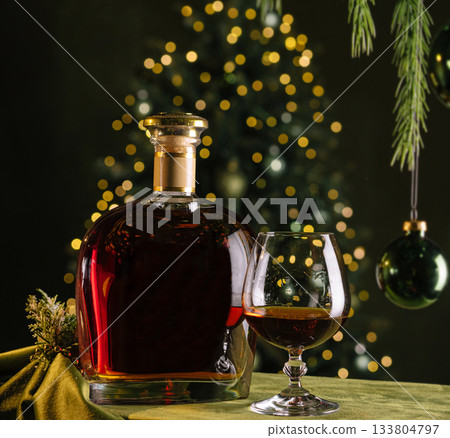 Holiday celebration with whiskey near a decorated Christmas tree Holiday celebration with whiskey near a decorated Christmas tree 133804797