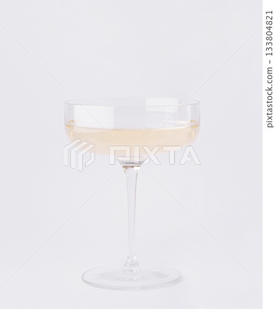 Elegant champagne glass filled with bubbly drink on a clean background 133804821