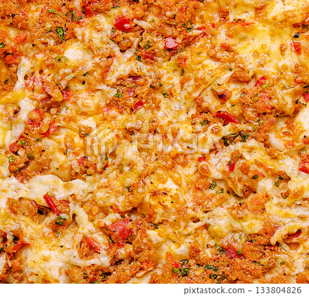 Delicious baked pasta with melted cheese and colorful veggies on top Delicious baked pasta with melted cheese and colorful veggies on top 133804826