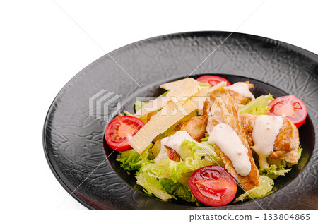 Grilled chicken salad with tomatoes and creamy dressing 133804865