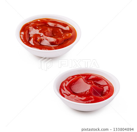 Many bowls of ketchup on a white background look appetizing and fresh Many bowls of ketchup on a white background look appetizing and fresh 133804894