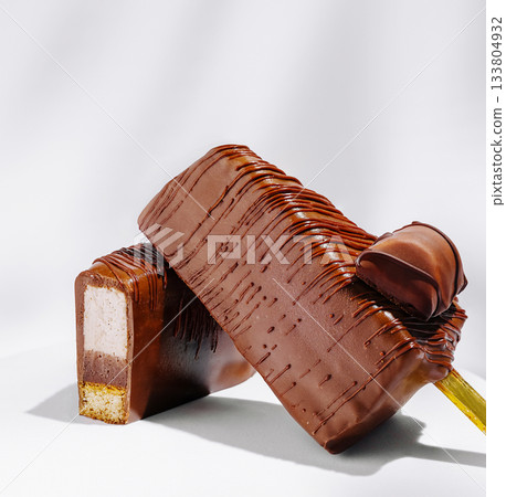 Chocolate dessert bars with creamy filling displayed on a clean background 133804932