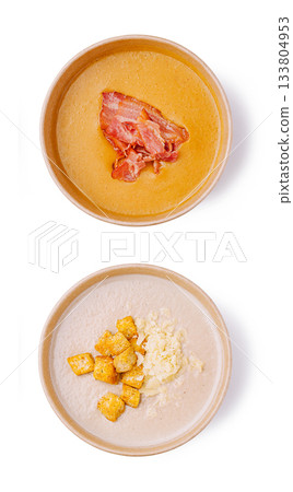 Warm soup with bacon on top and croutons with cheese on the side Warm soup with bacon on top and croutons with cheese on the side 133804953