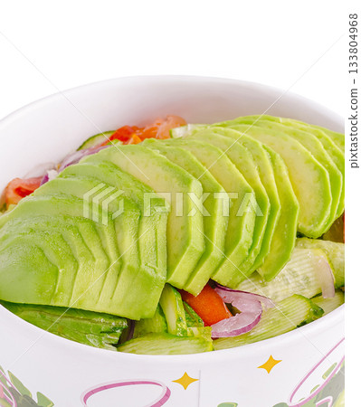 Fresh avocado salad with colorful vegetables and toppings in a bowl Fresh avocado salad with colorful vegetables and toppings in a bowl 133804968