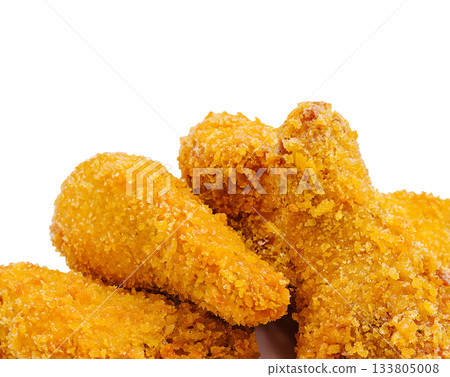 Crispy fried chicken pieces piled on a white background ready to eat 133805008
