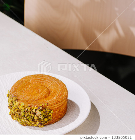 Delicious dessert served on a plate in a modern cafe setting 133805051